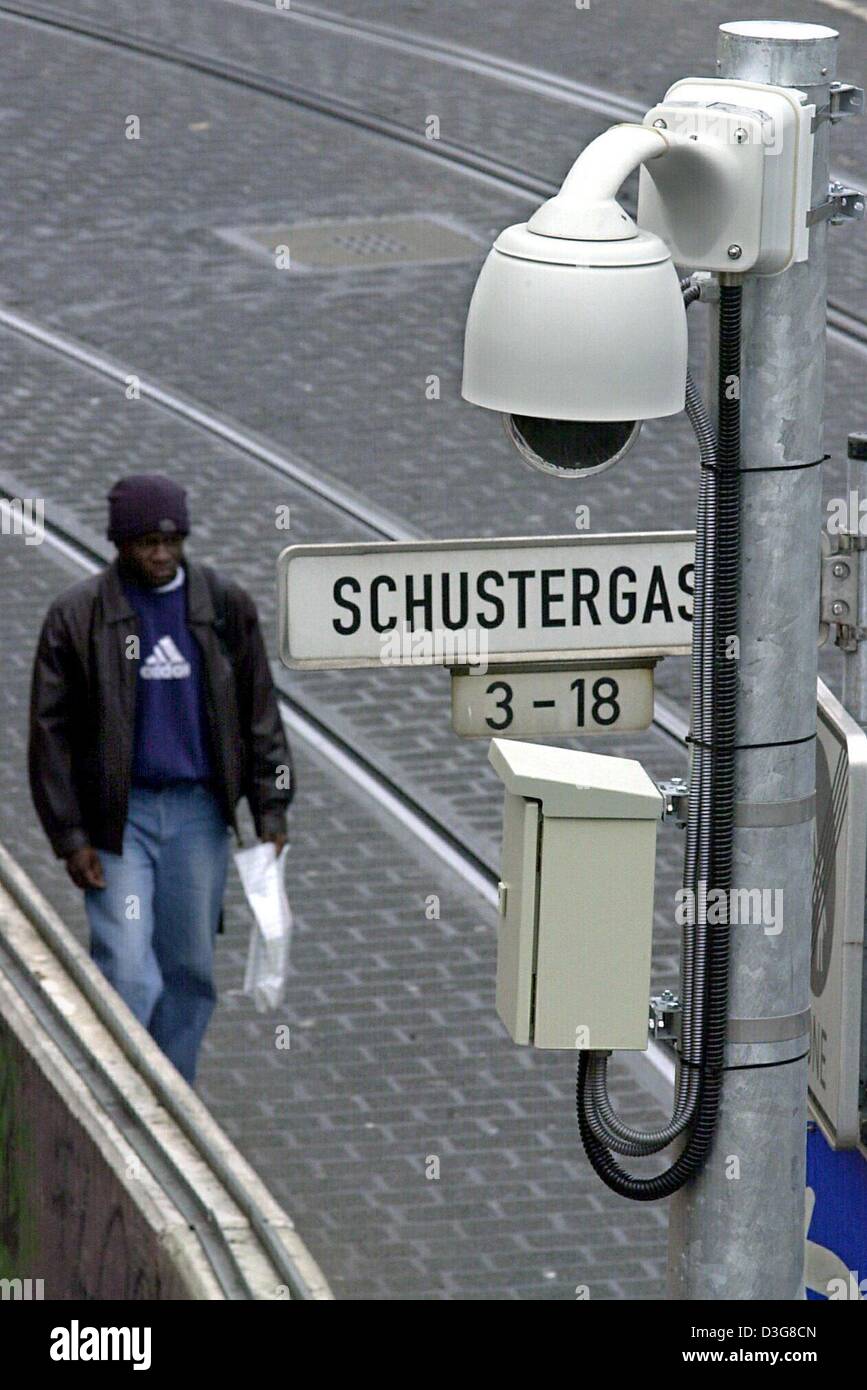 (dpa) - A man walks along a street, which is under video surveillance ...