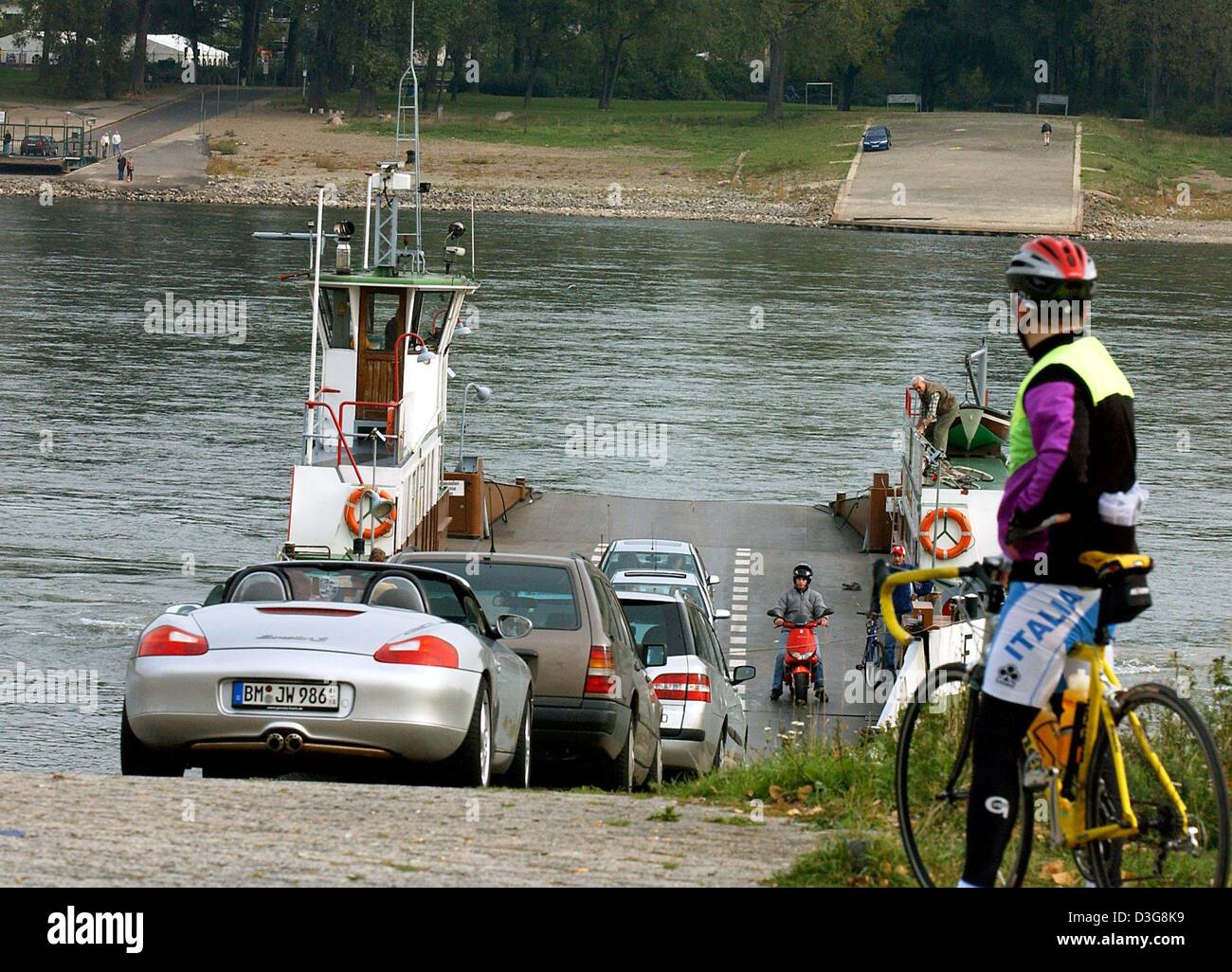 (dpa) - Cars are queuing to get on the car ferry to take them across the River Rhine, north of Cologne, 1 October 2003. The ferry is the connection between northern Cologne and Hitdorf for commuters. The ramps are steep this year due to the low water level of the River Rhine. Stock Photo
