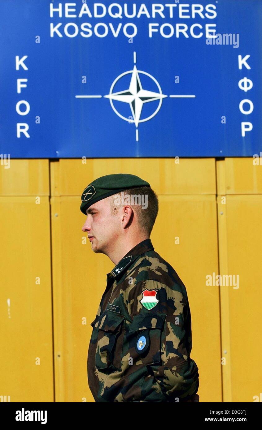 (dpa) - A Hungarian soldier of the international peacekeeping force KFOR stands in front of the KFOR headquarters in Prizren, Kosovo, 11 October 2003. Stock Photo