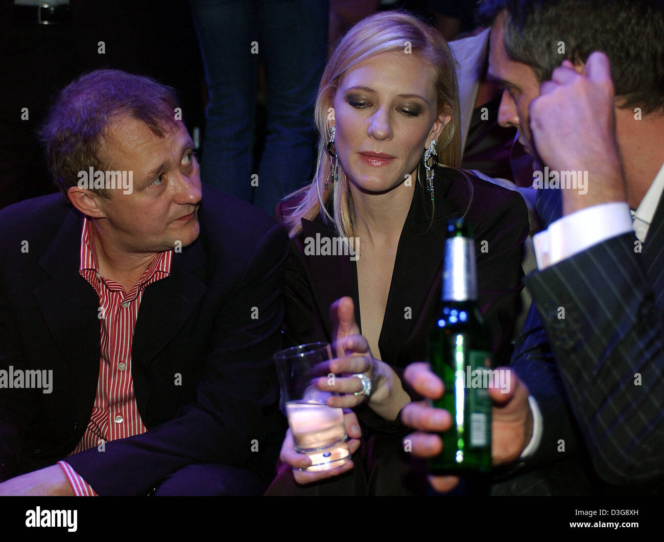 (dpa) - Australian actress Cate Blanchett and her husband Andrew Upton (L) visit the Boss fashion show at the German Opera in Berlin, Friday, 22 July 2005. The fashion company presented the Orange and Black line of its men's and women's summer 2006 collection. Stock Photo