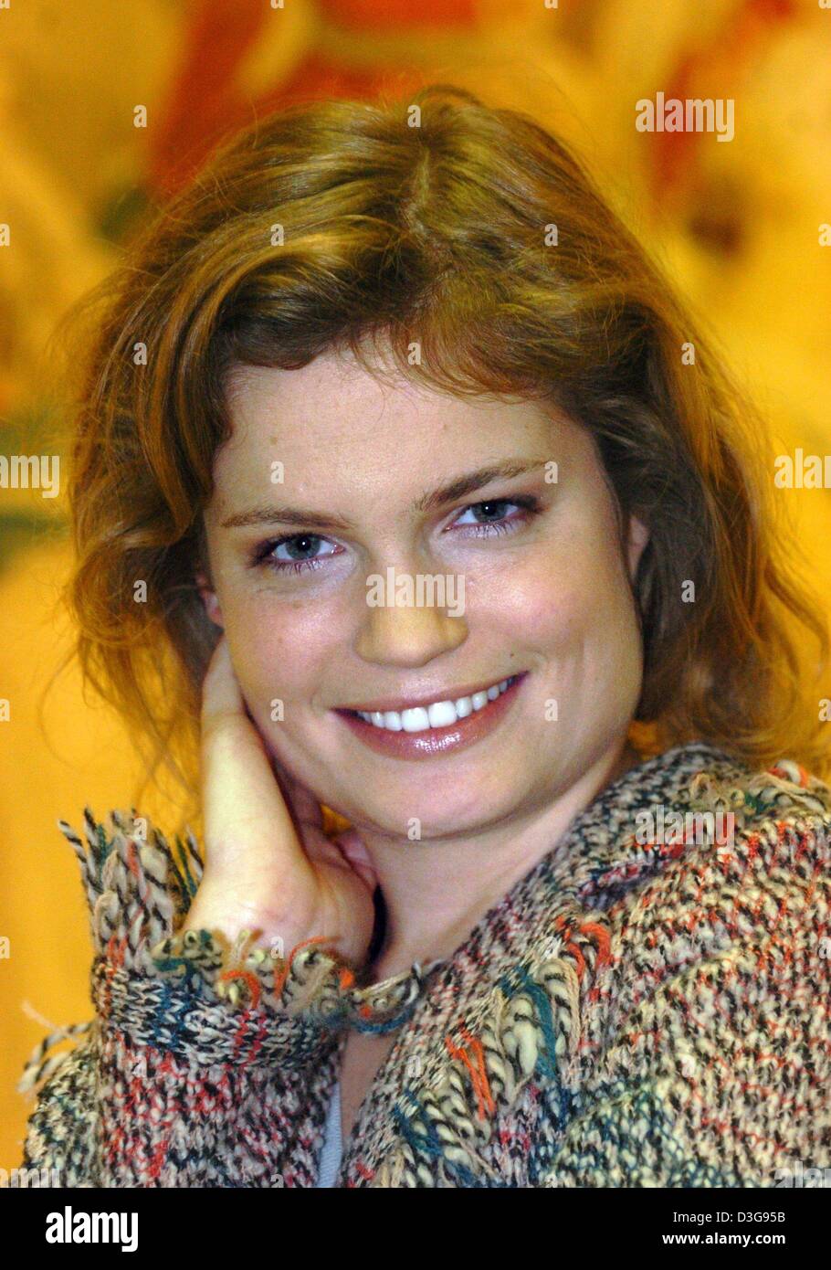 (dpa) - Actress Sarah Biasini, daughter of the late Romy Schneider, poses for the photographers during the presentation of the TV mini series 'Julie - The King's Agent' at the Four Seasons Hotel in Hamburg, Germany, 17 November 2004. The film centres around romance, intrigues and adventures at the court of the French Sun King in the 17th century. Biasini stars as opera singer Julie Stock Photo