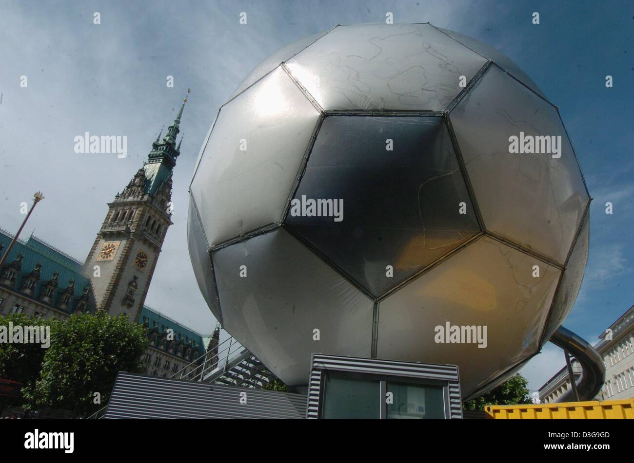 (dpa) - View of a globe in the shape of a soccer ball designed by Andre Heller as a promotional tool leading up to the FIFA Soccer World Cup 2006 in Germany. The globe, which will visit all 12 German World Cup host cities, opened for visitors in front of the city hall in Hamburg, Germany, 31 August 2004. The 20-meter-high structure offers several cultural and sports related events. Stock Photo