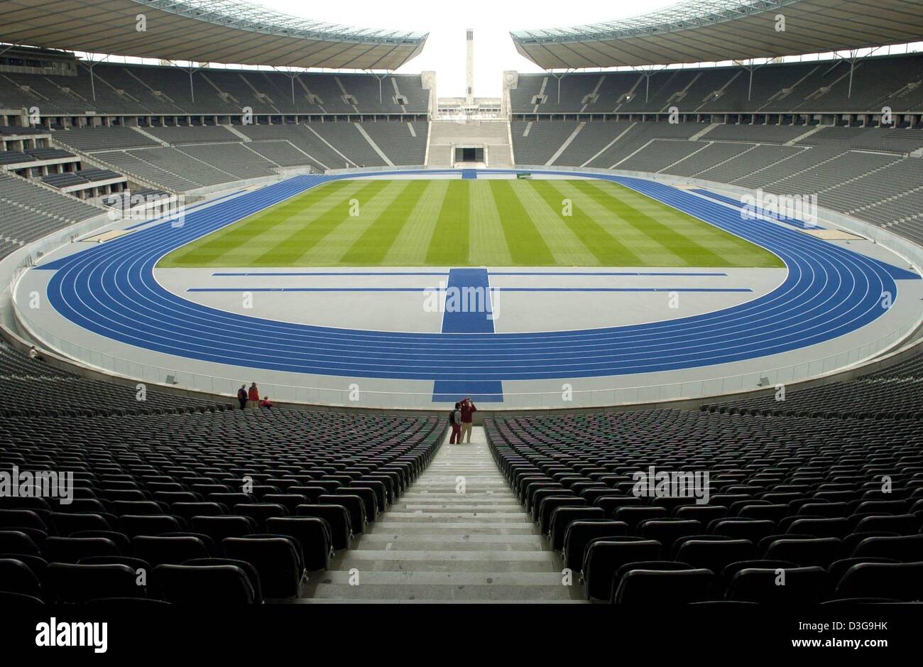 (dpa) - View of the inside of Olympic Stadium in Berlin, Germany, 27 August 2004. The stadium, which was originally built for the infamous 1936 Olympic Games that were used as a propaganda show by the Nazi regime, has been renovated at a cost of 240 million euros. The stadium, which now offers roofed seats for 76,000 spectators, will be the site of the FIFA Soccer World Cup final i Stock Photo
