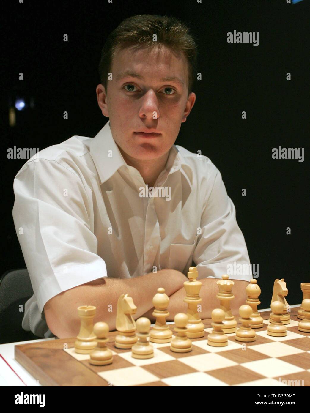 (dpa) - Local favourite Arkadij Naiditsch sits in front of a chess board during the 2004 Dortmund Chess Meeting in Dortmund, Germany, 23 April 2004. Naiditsch, who was born in Latvia and now lives in Dortmund, is considered one of Germany's top chess talents. Stock Photo