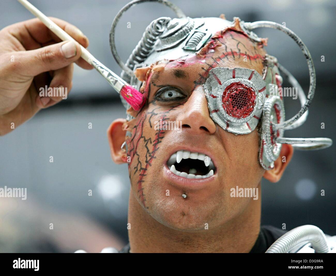 Dpa Tim An Actor Potraying A Cyborg At A Modern Haunted House Ride Has His Make Up Done For A Show At The Rheinkirmes Parish Fair In Duesseldorf Germany 15 July 04