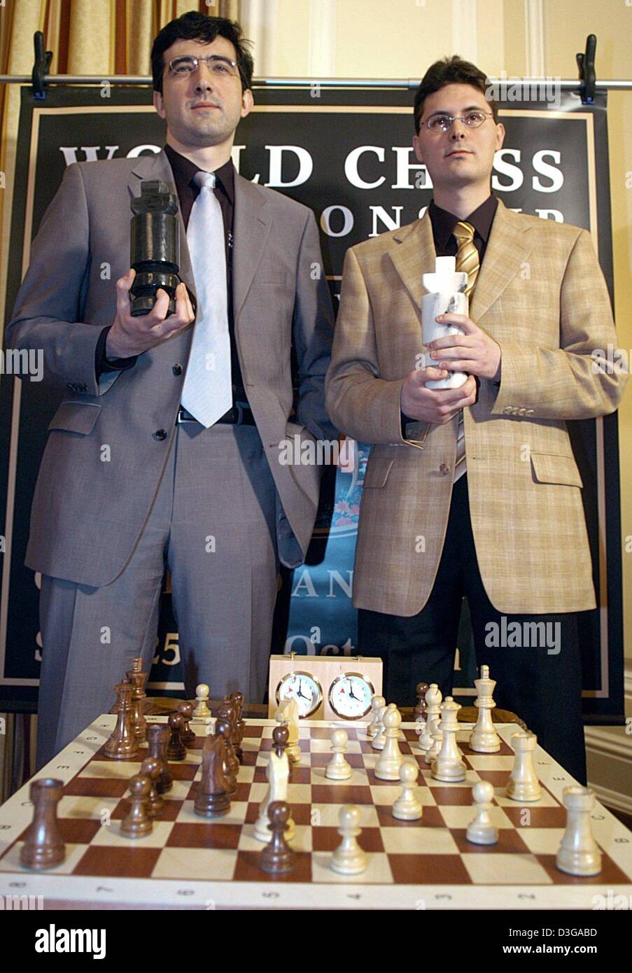 - Reigning Chess World Champion Vladimir Kramnik (L) from Russia and challenger Peter Leko pose with large chessmen during a press conference in Hamburg, Germany, 12 May 2004. During the