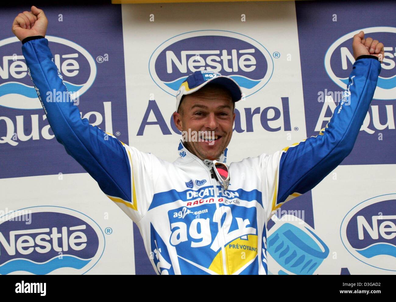 (dpa) - Cyclist Jaan Kirsipuu from Estonia (team AG2R) cheers on the podium after winning the first stage of the Tour de France in Charleroi, Belgium, 4 July 2004. The first and 202.5km long stage of the 91st Tour de France cycling race took the cyclists from Liege to Charleroi. Stock Photo