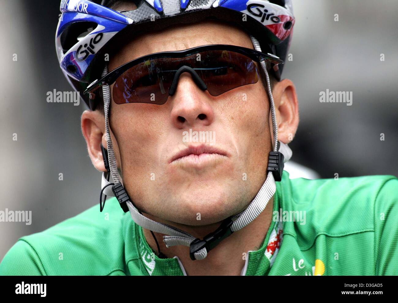 (dpa) - US Postal team rider and five-time Tour de France winner Lance Armstrong (L) from the US, wearing the best sprinter's green jersey, waits for the beginning of the first stage of the Tour de France, in Liege, Belgium, 4 July 2004. The first and 202.5km long stage of the Tour de France cycling race leads from Liege to Charleroi. Stock Photo