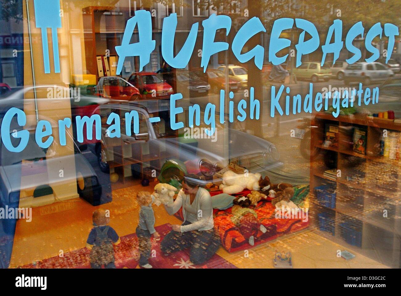 (dpa) - A nursery-school teacher playing with children can be seen