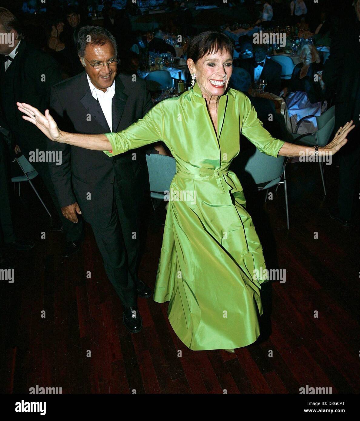 (dpa) - US actress Geraldine Chaplin dances with her longtime companion, Chilean artist Patricio Castilla, at the 'Ball der Sterne' charity event in Mannheim, Germany, 16 October 2004. Over 2,000 guests, among them many international celebrities, attended the 15th charity ball hosted by private German radio station Radio Regenbogen to raise money for charitable causes. The motto of Stock Photo