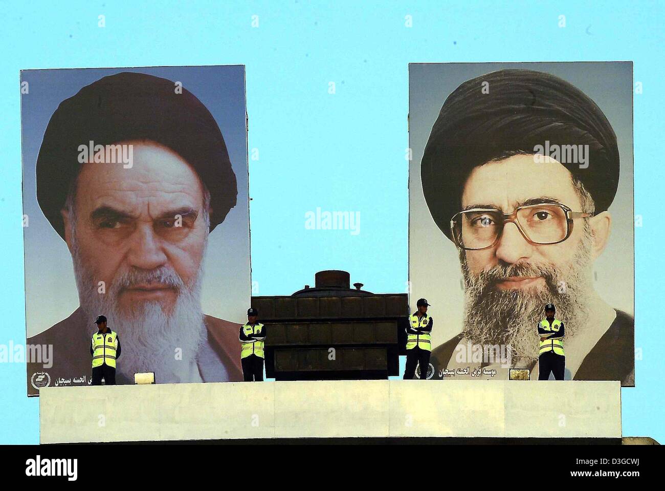 (dpa) - The pictures of political and religious leaders Ayatollah Khomeini (L) and Ayatollah Khamenei as well as several security guards watch over Azadi Stadium in Tehran, Iran, 9 October 2004. The German soccer team met Iran's national squad in an international friendly on Saturday, 9 October 2004. Stock Photo