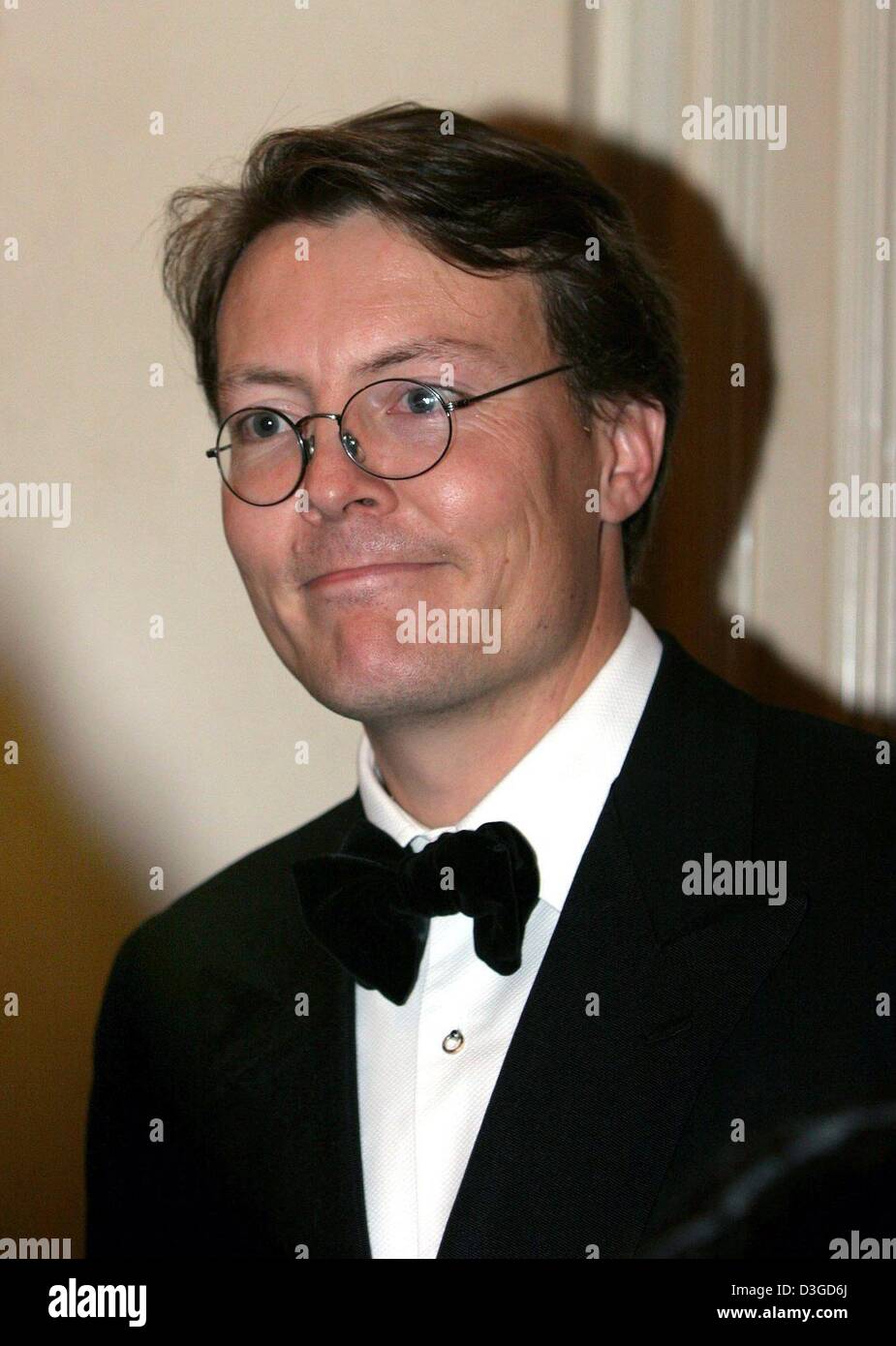 (dpa) - Prince Constantijn of the Netherlands smiles as he and his wife Princess Laurentien arrive for the opening of the Golden Children's Book Week at the theatre at the Leidseplein in Amsterdam, the Netherlands, 5 October 2004. Stock Photo