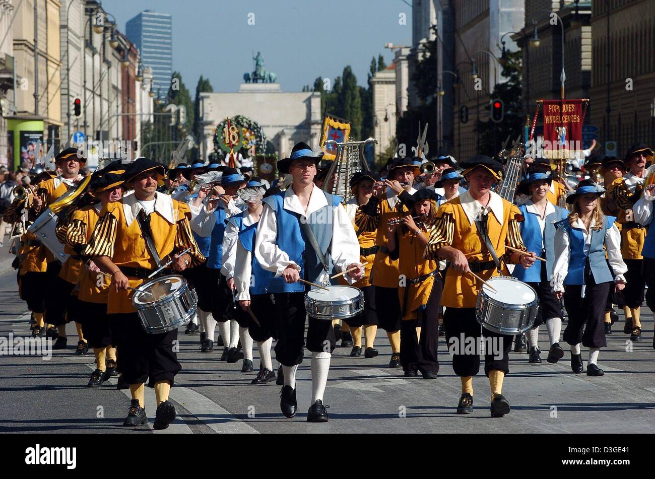 (dpa) - The members of Bavarian traditional music and costumes clubs play their instruments during a parade to mark the beginning of the Oktober Fest in downtown Munich, 19 September 2004. Six million people are expected to visit the Munich Oktoberfest, which is one of the world's biggest and most famous festivals. The beer fest runs until 3 October. Stock Photo