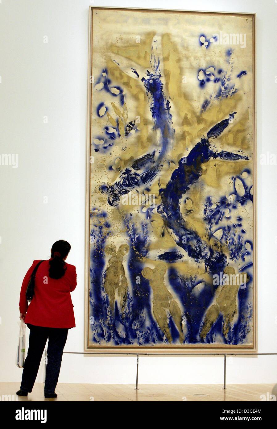 dpa) - A visitor looks at the painting 'anthropometry' by Yves Klein at the  Schirn art hall in Frankfurt, Germany, 16 September 2004. The exhibition  featuring works by the famous French artist