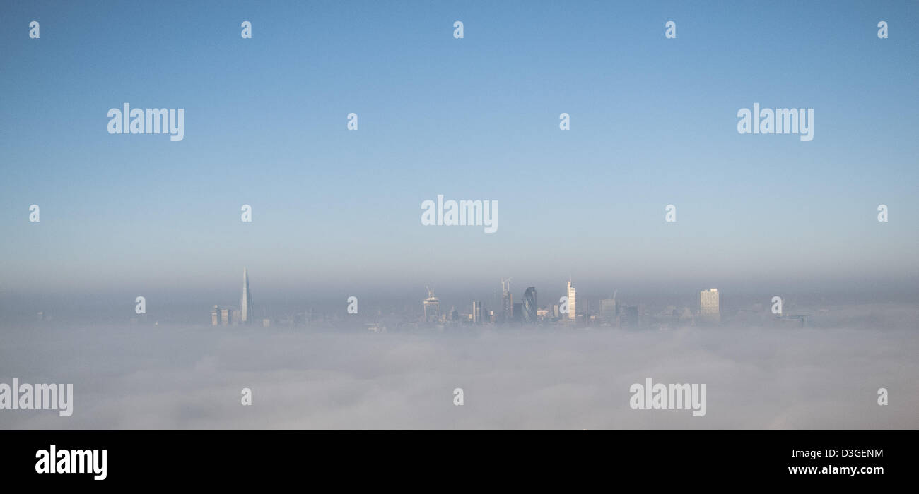 London, UK.  19th February, 2013. The tall buildings of London's iconic skyline poke through the low mist on a crisp February morning. Credit:  Steve Bright / Alamy Live News Stock Photo