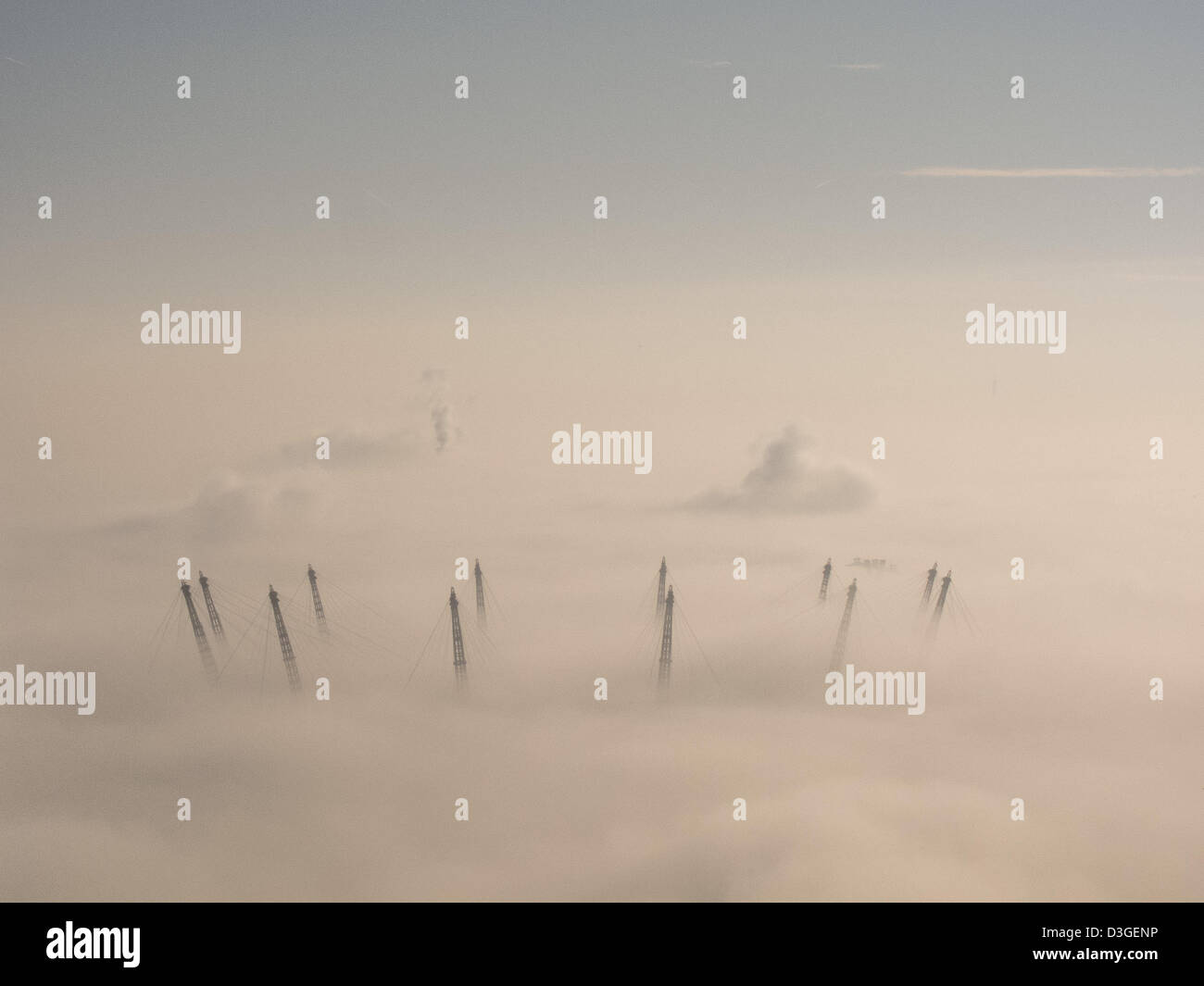 London, UK.  19th February, 2013. The masts of London's iconic O2 Arena poke through the low mist on a crisp February morning. Credit:  Steve Bright / Alamy Live News Stock Photo
