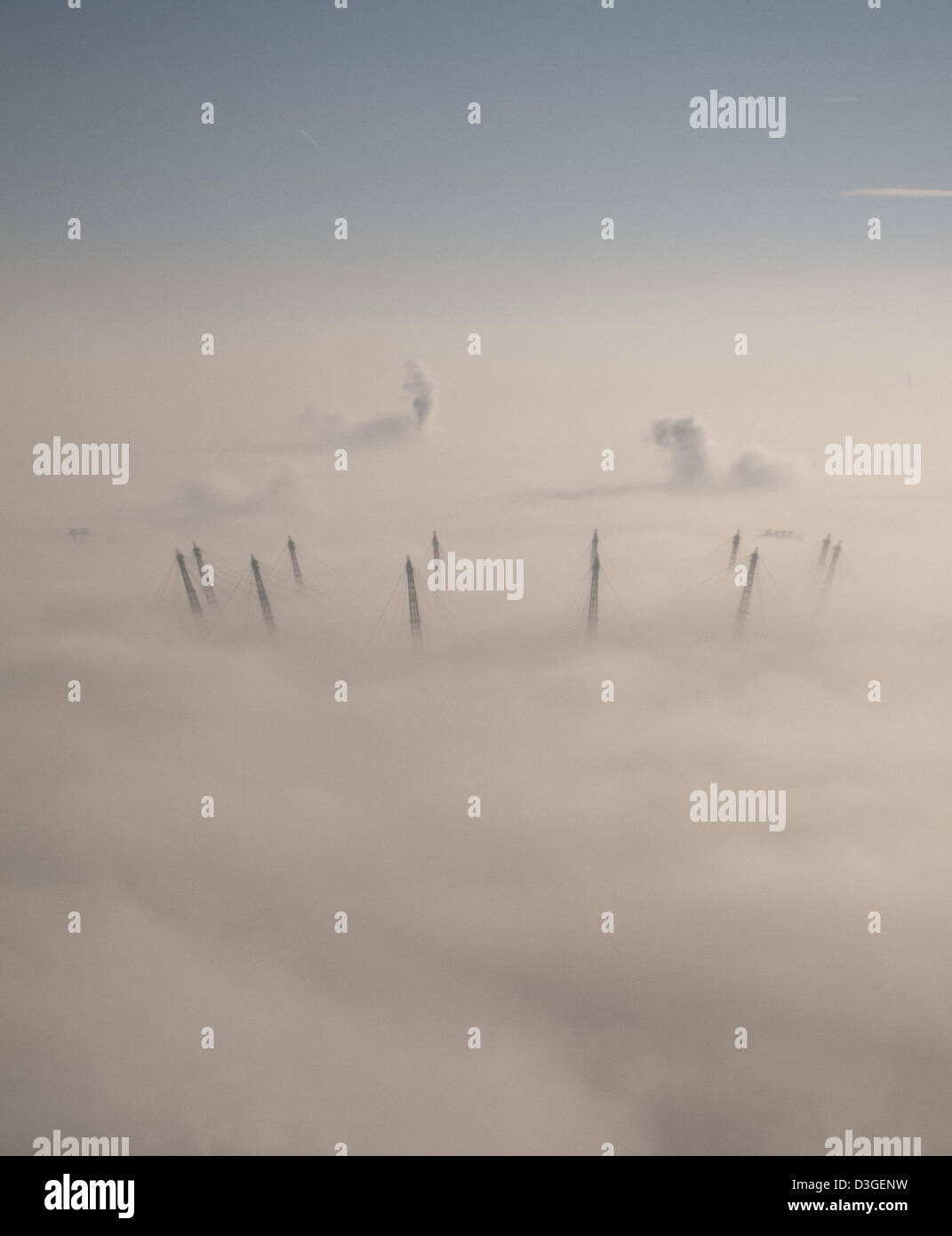 London, UK.  19th February, 2013. The masts of London's iconic O2 Arena poke through the low mist on a crisp February morning. Credit:  Steve Bright / Alamy Live News Stock Photo