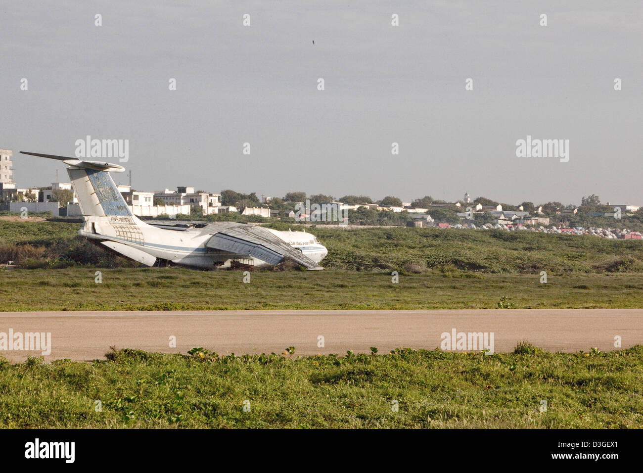 A disused aeroplane on the side of the main runway at Aden Ade International Airport Stock Photo