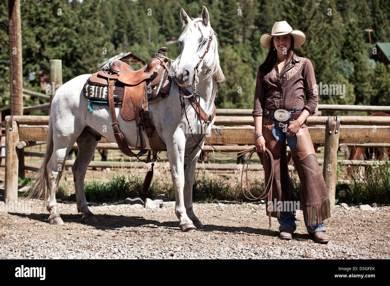 Cowgirl wrangler with horse, ranching, Montana, USA Stock Photo