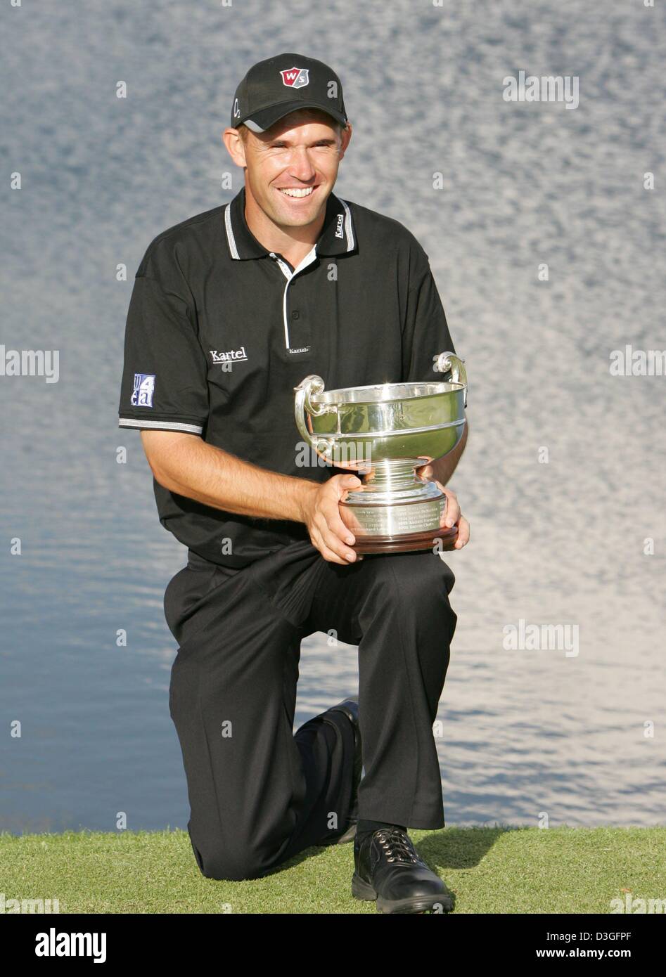(dpa) - 33-year-old Irish golf pro Padraig Harrington poses with the trophy after winning the German Masters Golf Tournament on the 72-par course in Pulheim, Germany, 12 September 2004. It was Harrington's seventh triumph in Europe since 1996. Stock Photo