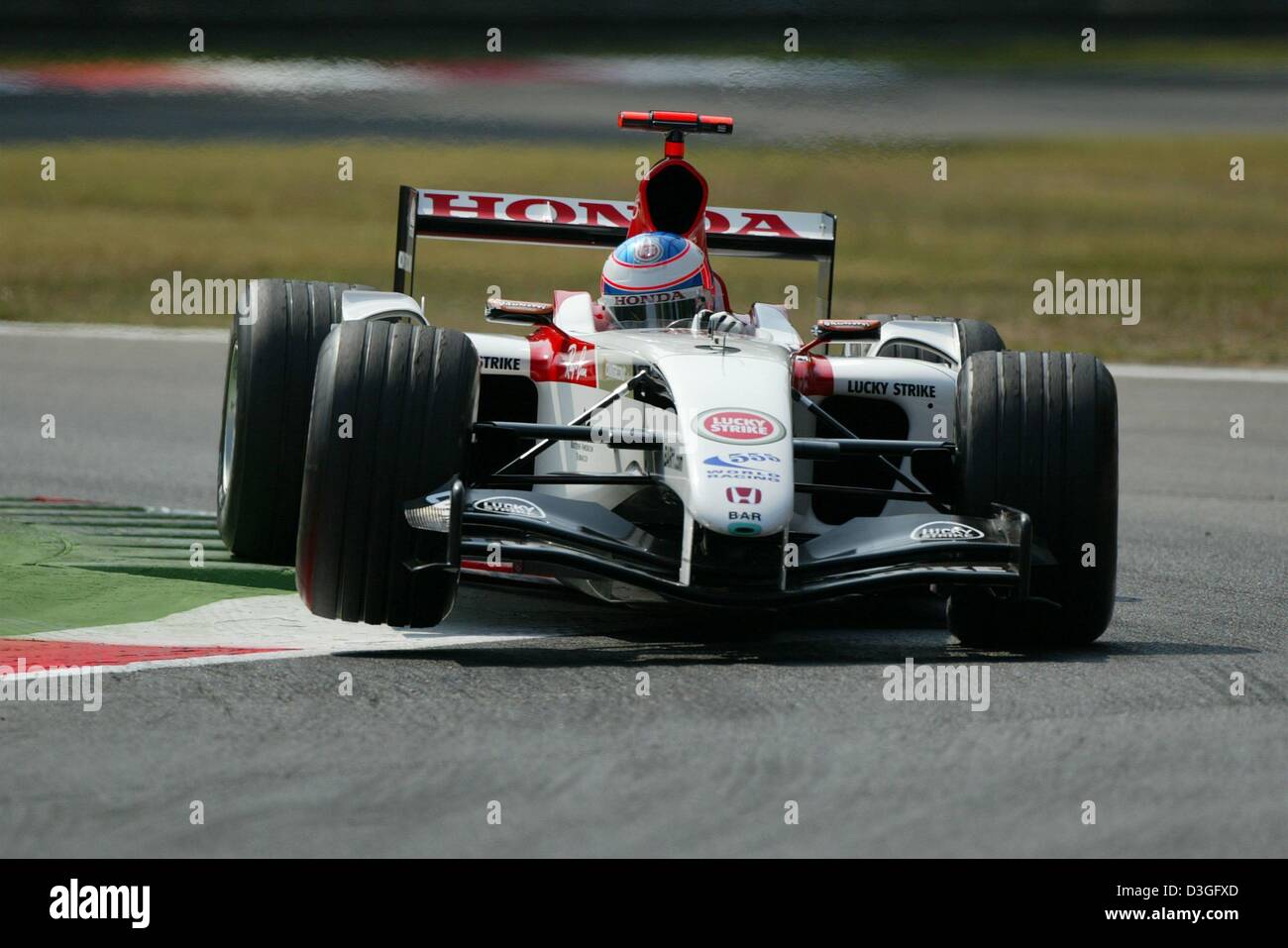 (dpa) - British formula one pilot Jenson Button (Bar-Honda) races through the a curve during the training session for the Italian Grand Prix in Monza, Italy, 10 September 2004. The Grand Prix will be held on Sunday, 12 September 2004. Stock Photo