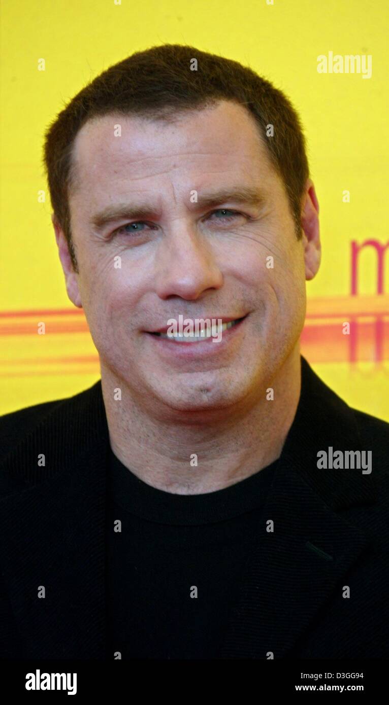(dpa) - Hollywood actor John Travolta smiles during the presentation of his film 'A Love Song For Bobby Long' during a press conference at the 61st International Exhibition of Cinema Art, better known as Venice Film Festival, Italy, 2 September 2004. Stock Photo