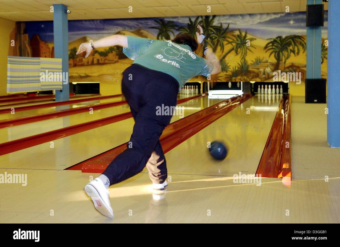 (dpa) A bowler sends a ball down the lane at a bowling alley in