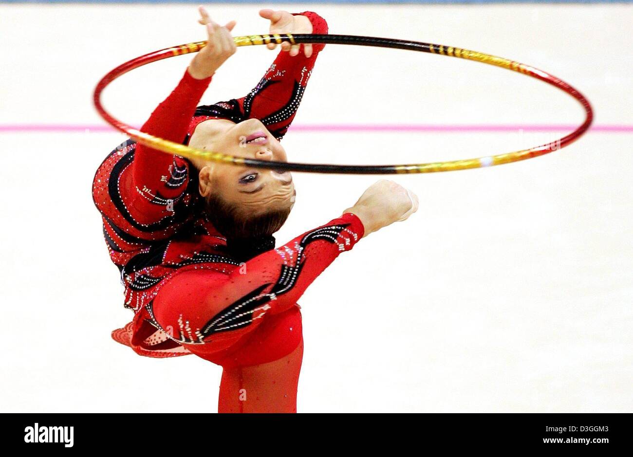 (dpa) - First placed Alina Kabaeva of Russia performs with the hoop in the gymnastics rhythmic individual all-around qualification at the Athens 2004 Olympic Games, Thursday, 26 August 2004. Stock Photo