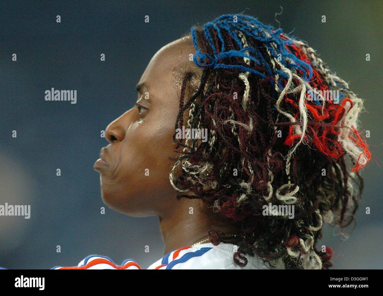 (dpa) - French long jumper Eunice Barber shows a taste for unique hairstyles as she waits for the start of the Women's Olympic Long Jump Qualifikation Round at  Olympic Stadium in Athens, Greece, 25 August 2004. Stock Photo
