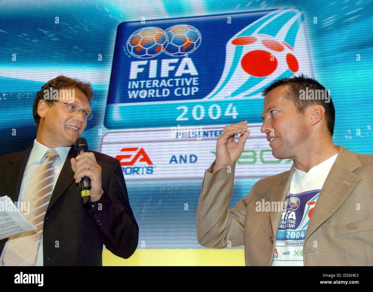 (dpa) - Lothar Matthaeus (R), former soccer player in the German national soccer squad and current coach of the Hungarian national soccer team, stands next to Jerome Valcke, Head of marketing of FIFA, at the GC-Games Convention fair in Leipzig, Germany, Thursday, 19 August 2004. FIFA is taking up the patronage for the first interactive soccer world championship. Fans throughout the Stock Photo