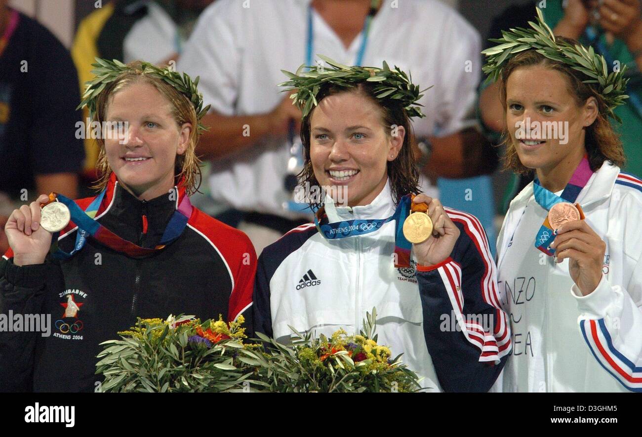 (dpa) - (from L:)  Kirsty Coventry from Zimbabwe (silver), US swimmer Natalie Coughlin (gold) and Laure Manaudou from France (bronze) show their medals to the photographers after the women's 100 m backstroke final at the Olympic Aquatic Centre in Athens, Monday 16 August 2004. Stock Photo