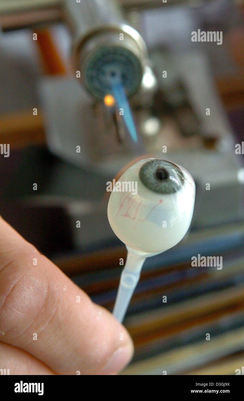 (dpa) A glass eyeball is shaped with a gas burner at Augenprothetik