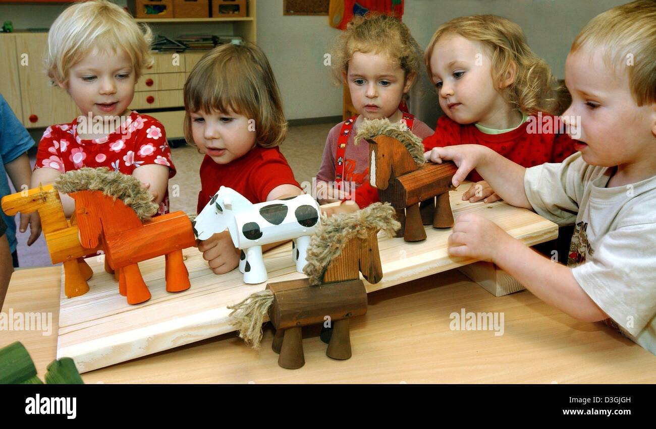 playing with toy horses