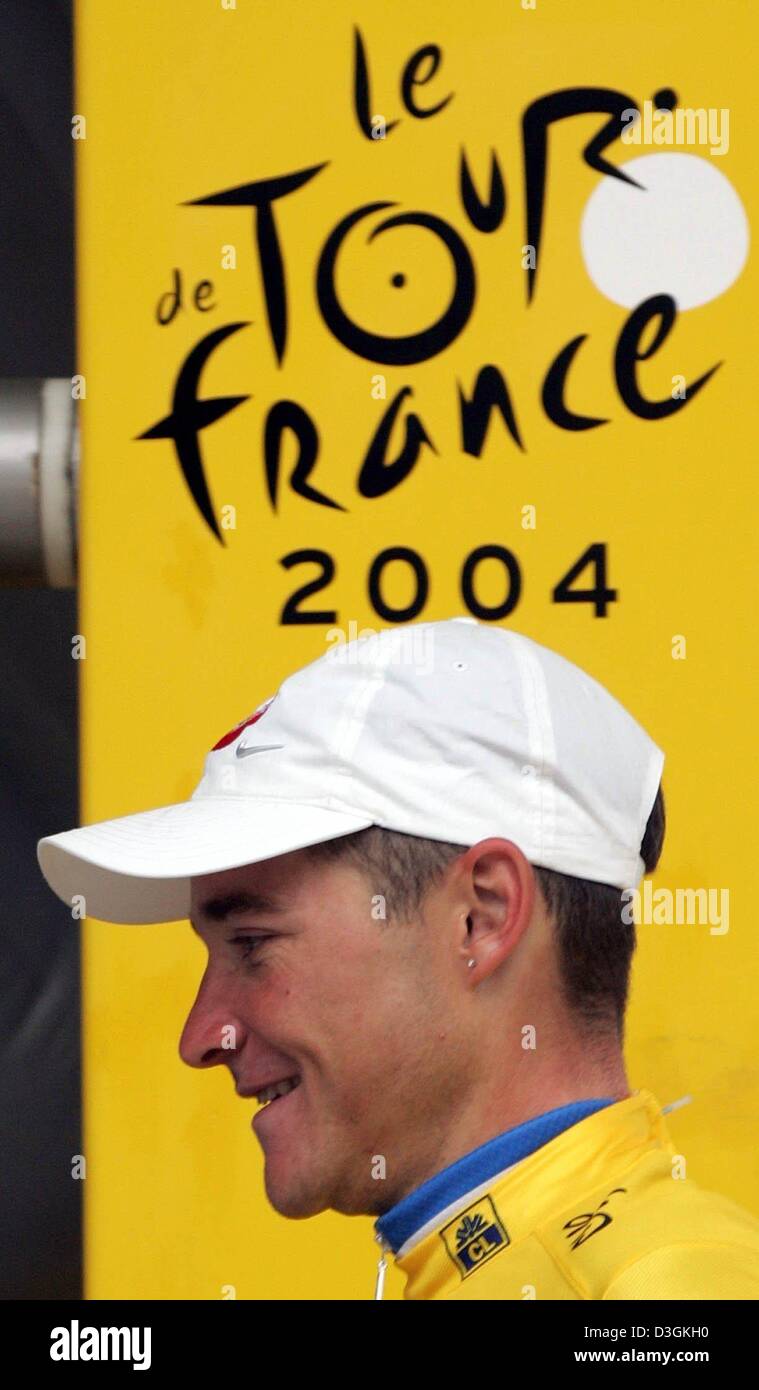 (dpa) - French cyclist Thomas Voeckler of team Brioches La Boulangere smiles after defending the yellow jersey of the overall leader after the 14th stage of the Tour de France cycling race in Nimes, France, 18 July 2004. The 192.5 km long stage led from Carcassonne to Nimes. Stock Photo