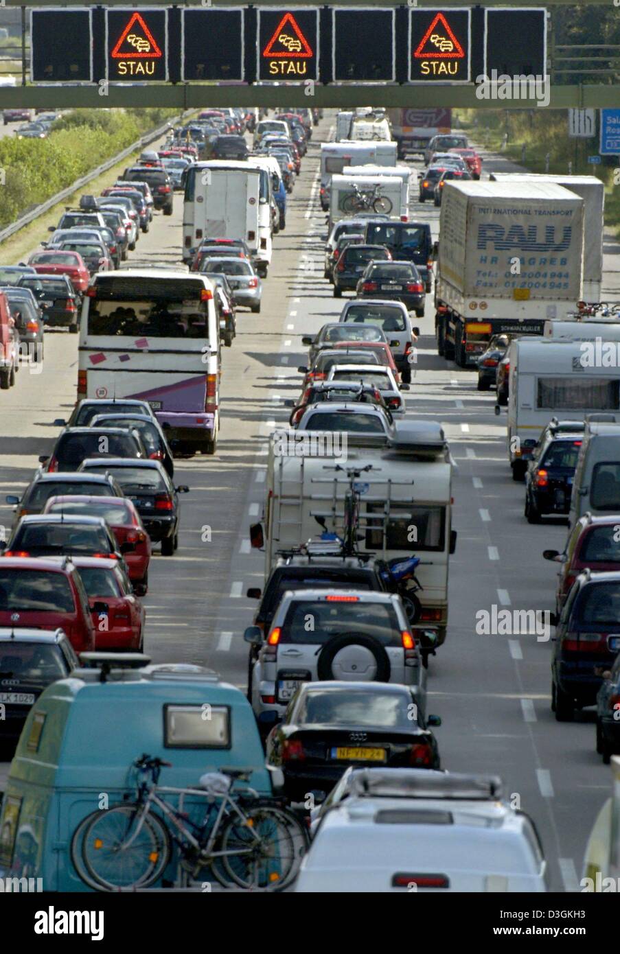 (dpa) A ten kilometer long traffic jam has formed on highway A8 near Munich, Germany, 16 July 2004. Due to the start of the summer holidays in three German states congested highways heading south were expected for the whole weekend. Stock Photo