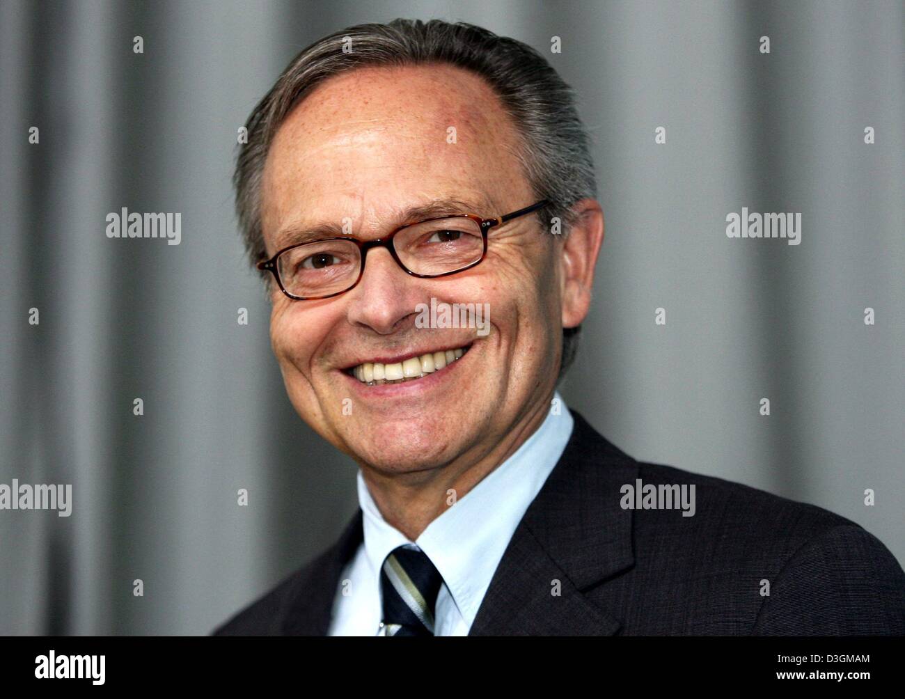 (dpa) - Guenther Fielmann, chairman of Fielmann AG, smiles during the company's general meeting in Hamburg, Germany, 8 July 2004. Stock Photo