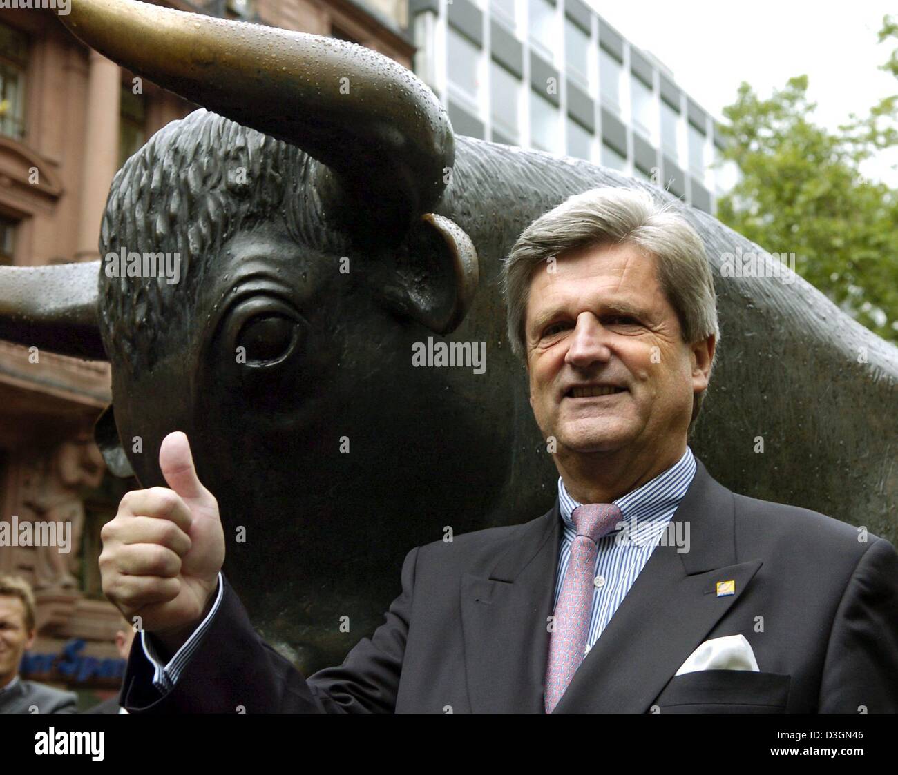 (dpa) - Postbank chairman Wulf von Schimmelmann (L) gives a thumbs up ...