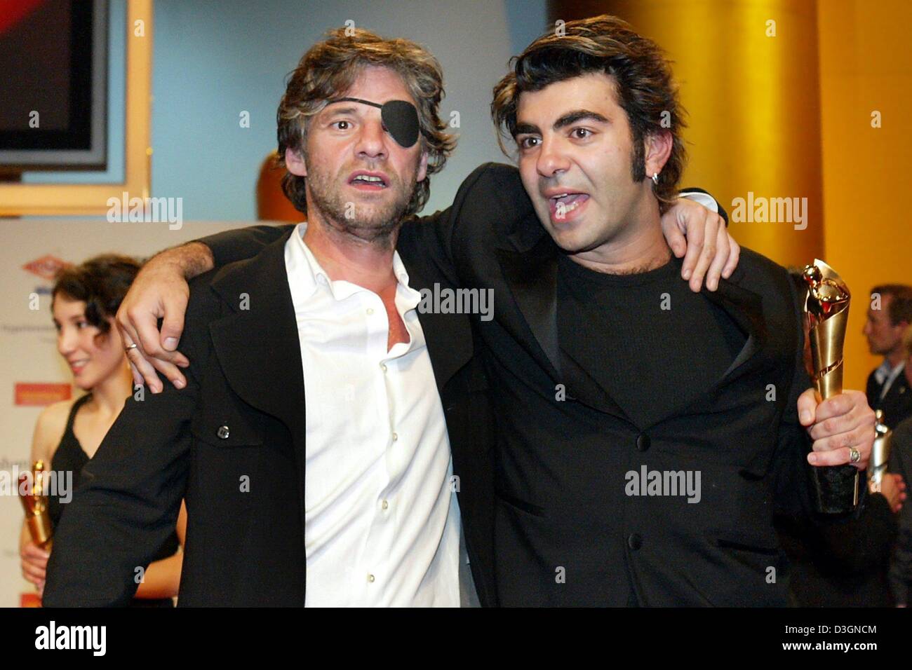 (dpa) - Director Fatih Akin (R) and actor Birol Uenel pose with their ...