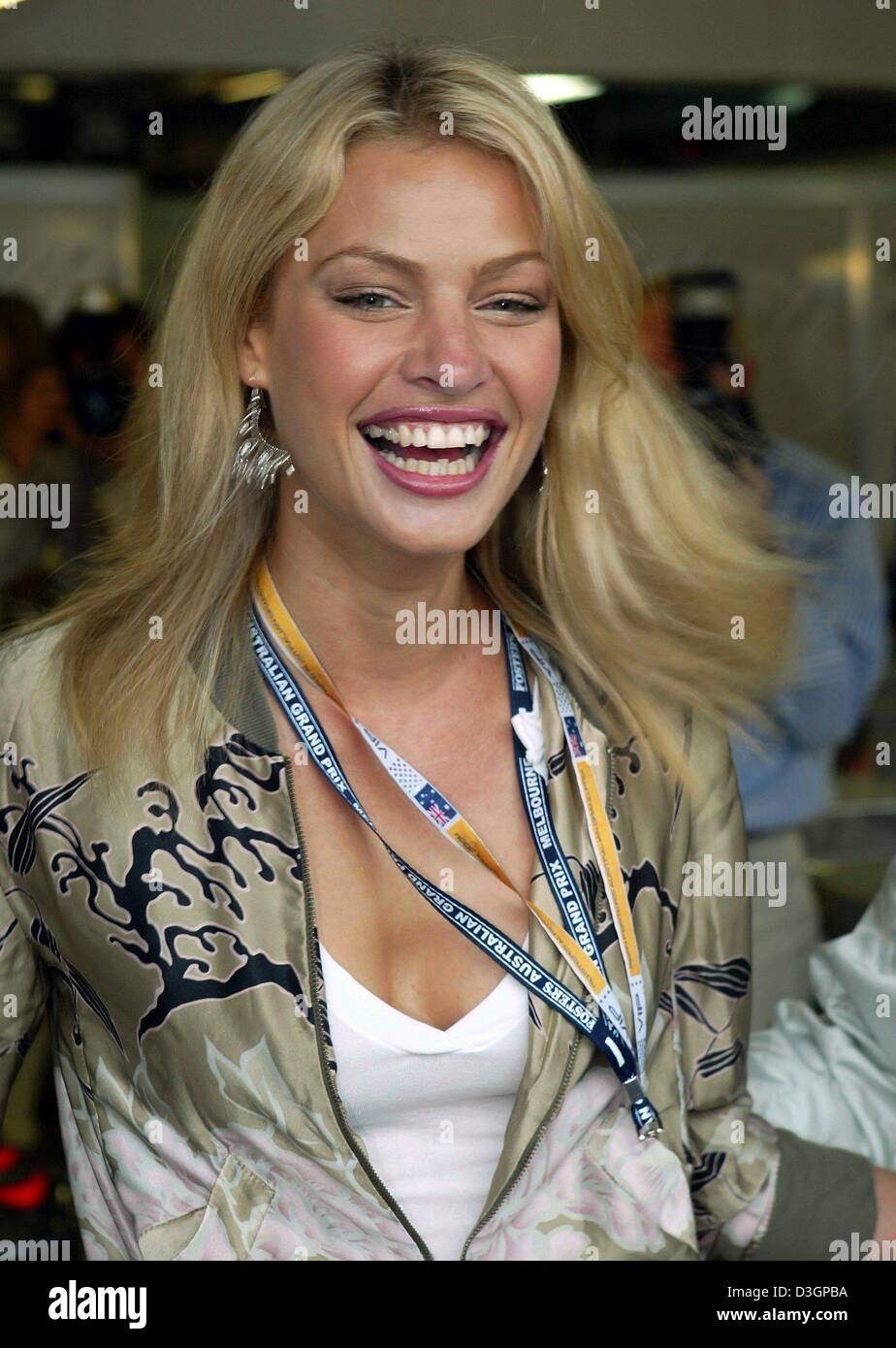 (dpa) The Australian model Kristy Hinze beams into the camera at the 'Albert Park' racetrack on Sunday, 7 March, 2004 in Melbourne. Stock Photo