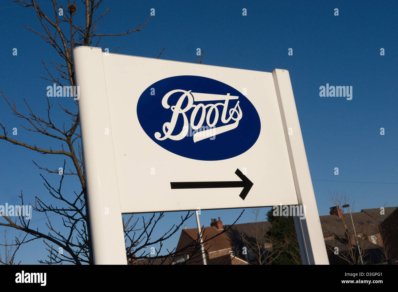 Large sign pointing to a Boots chemist store Stock Photo - Alamy
