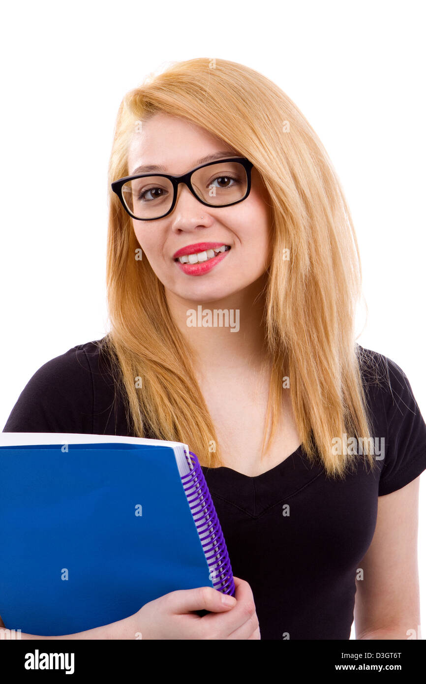 Stylish young college student holds her textbooks and smiles wearing glasses. Stock Photo
