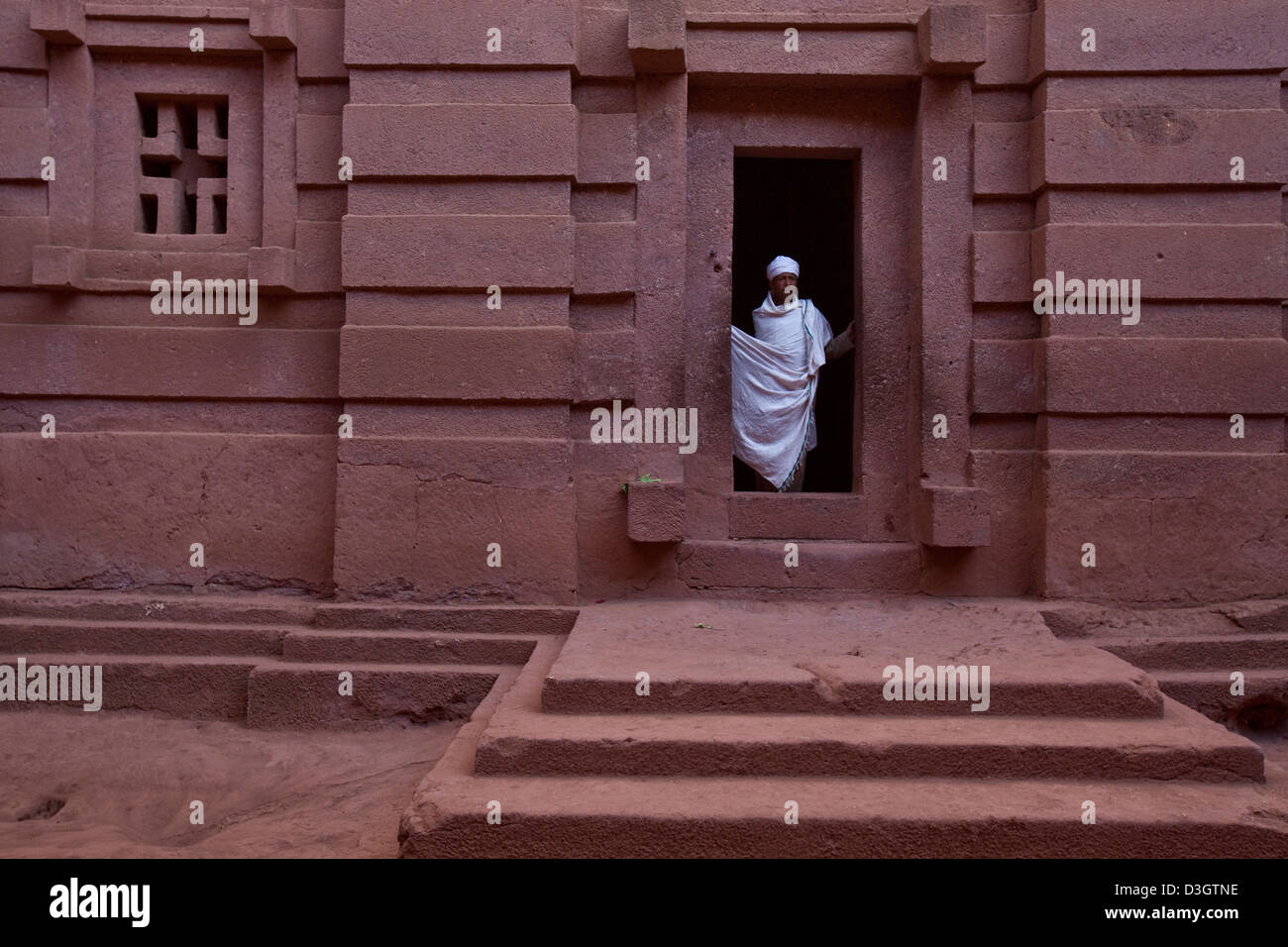 Priest in Bet Danaghel Church holding the Cross of King Lalibela. The  rock-hewn churches of Lalibela make it one of the greatest  Religio-Historical sites not only in Africa but in the Christian