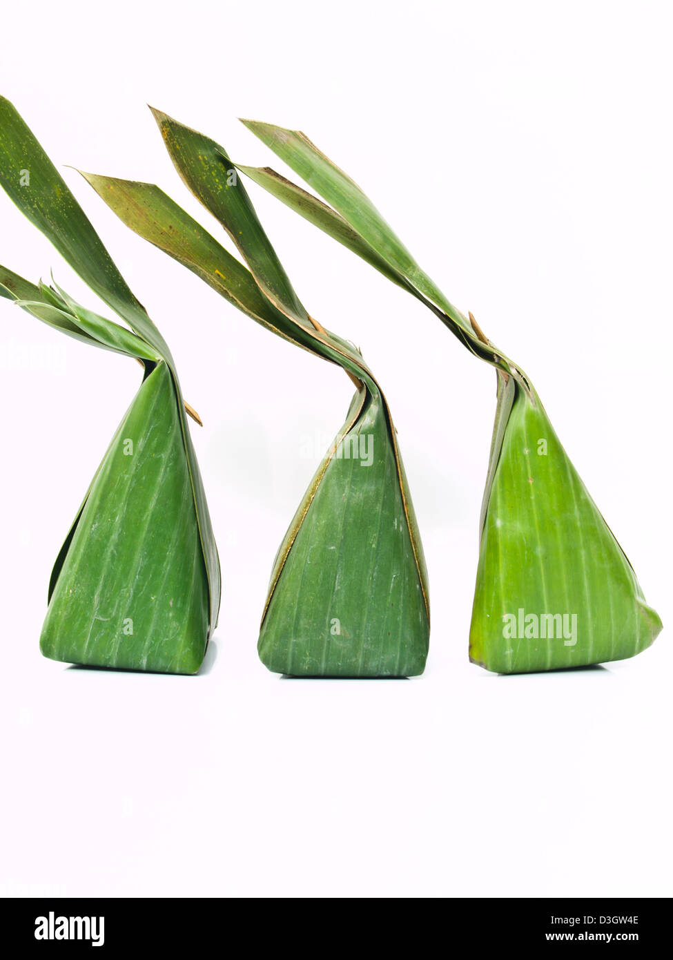 Thai dessert packages made from banana leaves Stock Photo