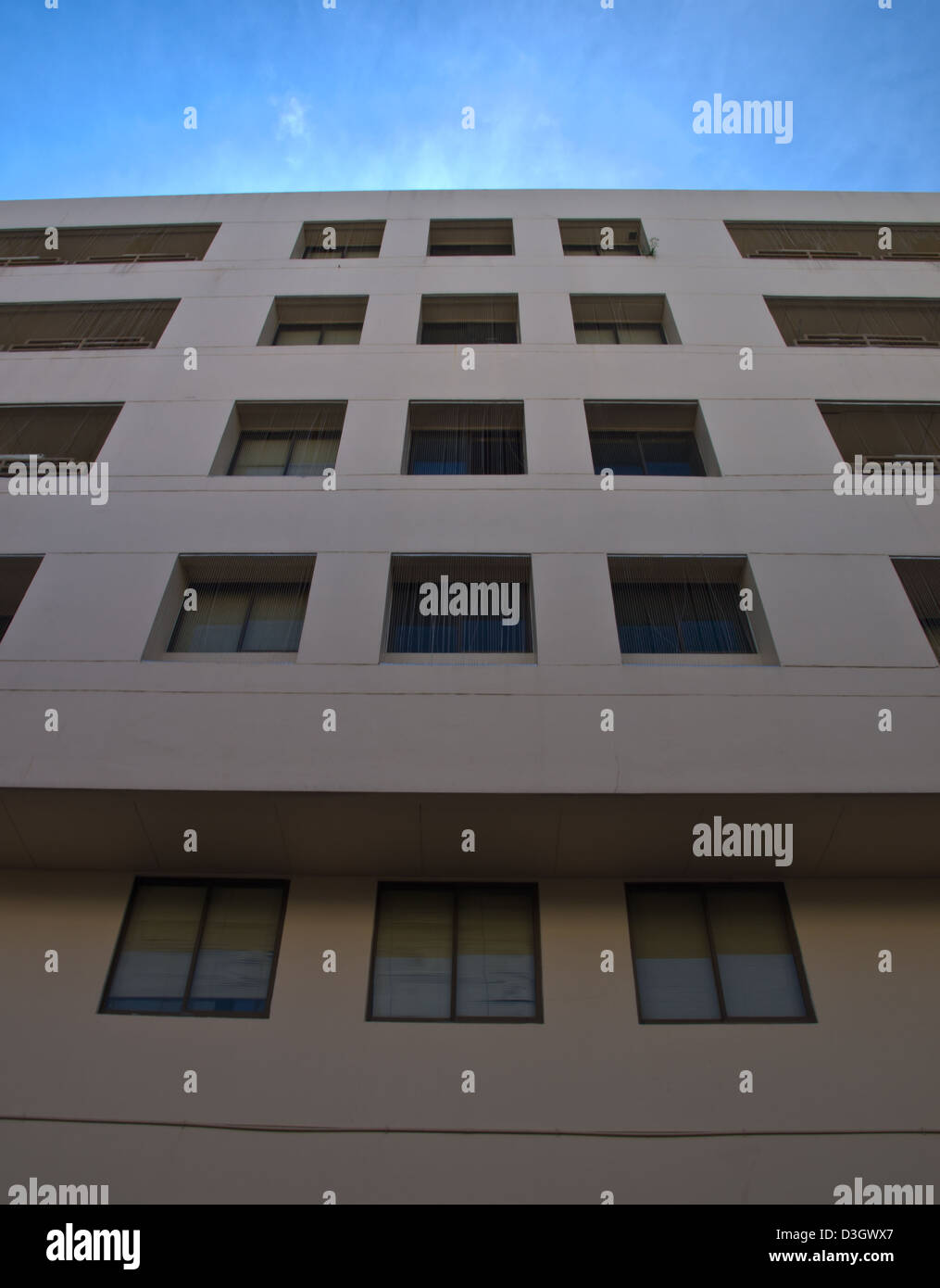 Facade windows of office building on blue sky Stock Photo - Alamy