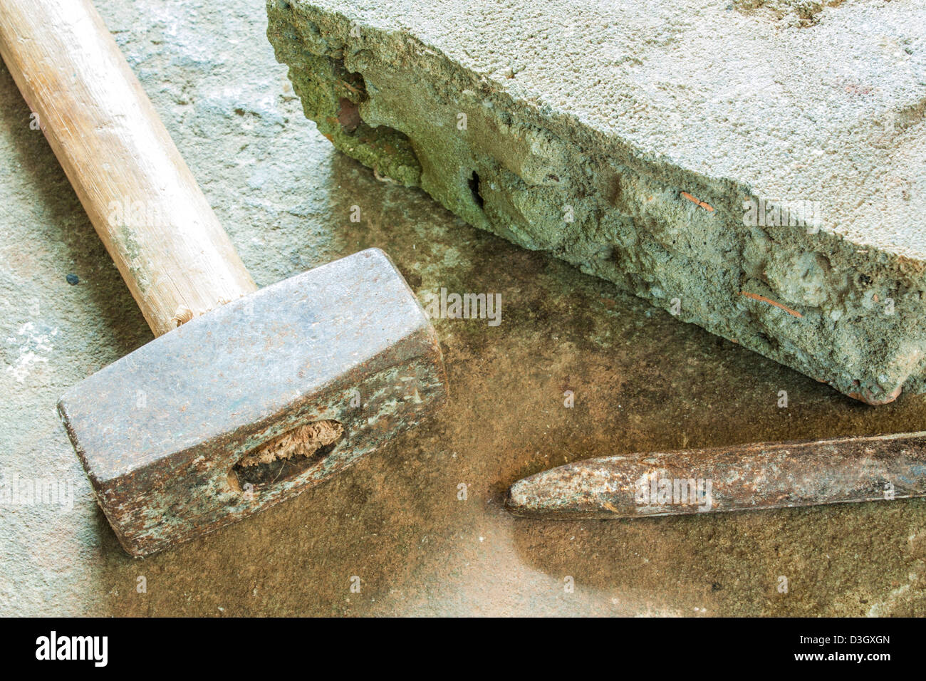 bricklayer tools (chisel , hammer and block) ,construction background