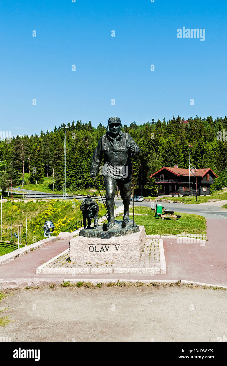 A bronze sculpture of KIng Olav V, King of Norway 1957-1991, cross-country  skiing with his dog Troll at Holmenkollen, Oslo Stock Photo - Alamy