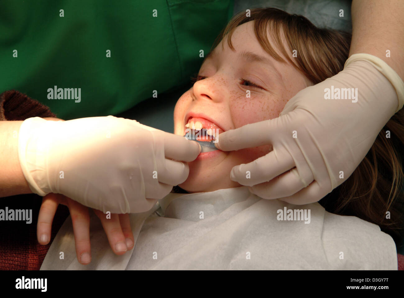 CHILD RECEIVING DENTAL CARE Stock Photo