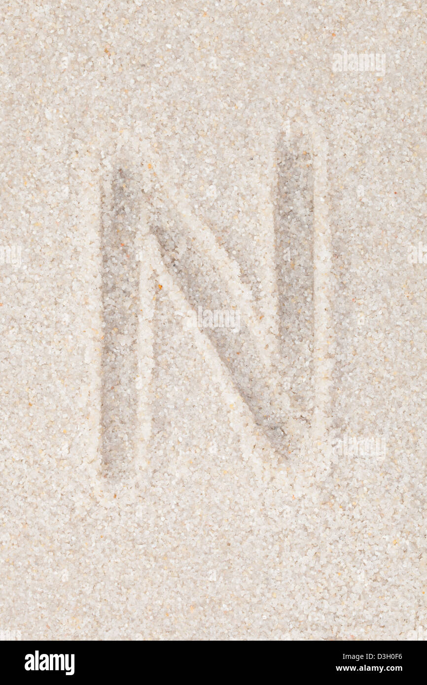 Alphabet writing on the sand - Letter N Stock Photo - Alamy