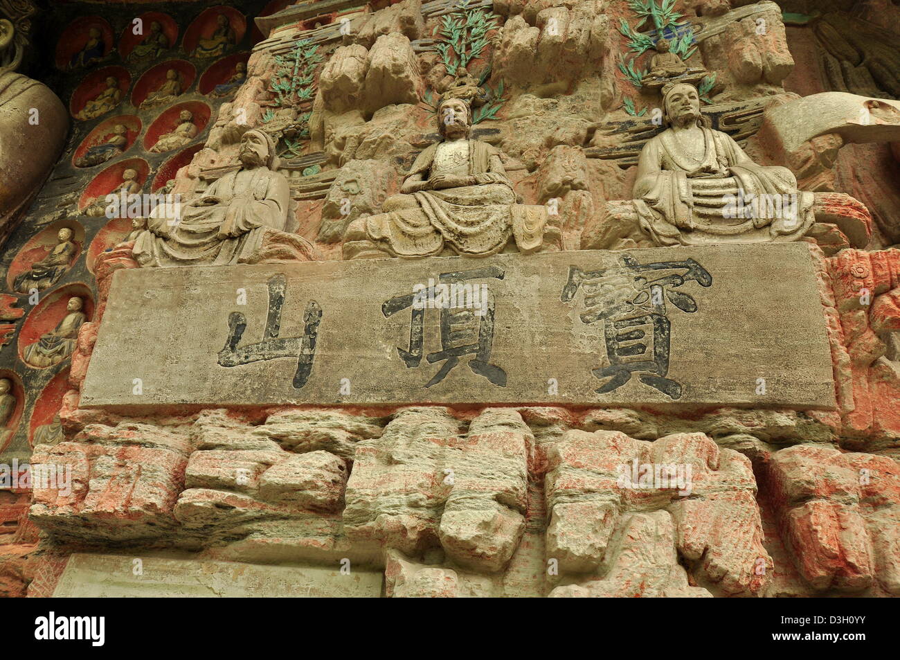 Ancient Buddhist Hillside Rock Carvings (Vast Jeweled Pavilion) - Dazu, China Stock Photo