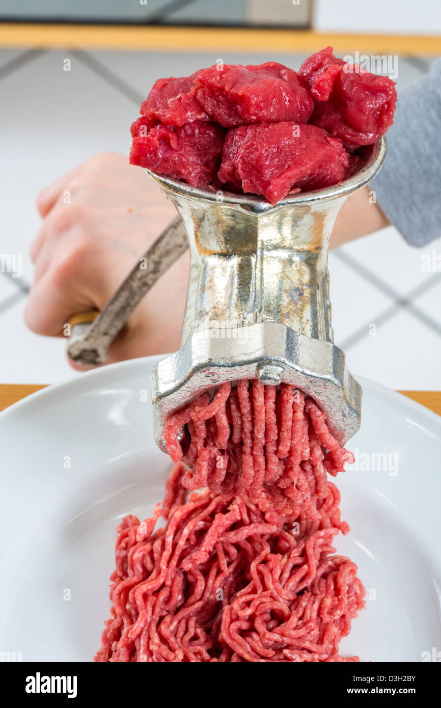 Meat grinder. Kitchen tool to mince meat Stock Photo Alamy